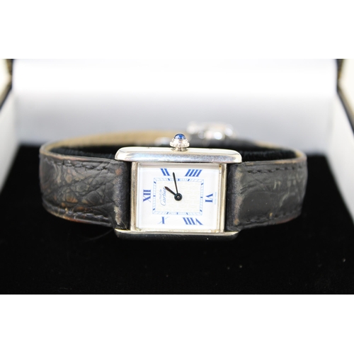 274 - A silver cased Must de Cartier tank wristwatch, the signed dial having insignia pattern to the centr... 