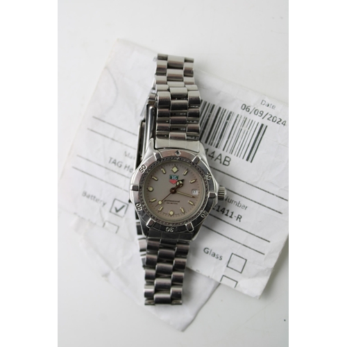 275 - A Tag Heuer Professional 200 Meters quartz, date movement ladies wristwatch. Silver tone dial with l... 