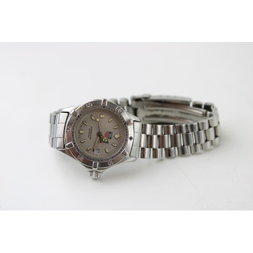 275 - A Tag Heuer Professional 200 Meters quartz, date movement ladies wristwatch. Silver tone dial with l... 