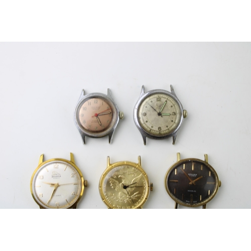 277 - A group of seven vintage manual wind watches many with Incabloc movements  and an unbranded example ... 