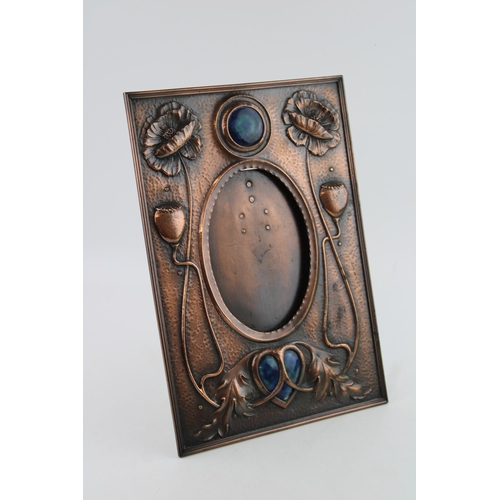 28 - A late c19th Liberty style Arts & Crafts copper Photograph frame with Heart shaped and round Ruskin ... 