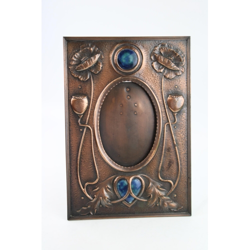 28 - A late c19th Liberty style Arts & Crafts copper Photograph frame with Heart shaped and round Ruskin ... 