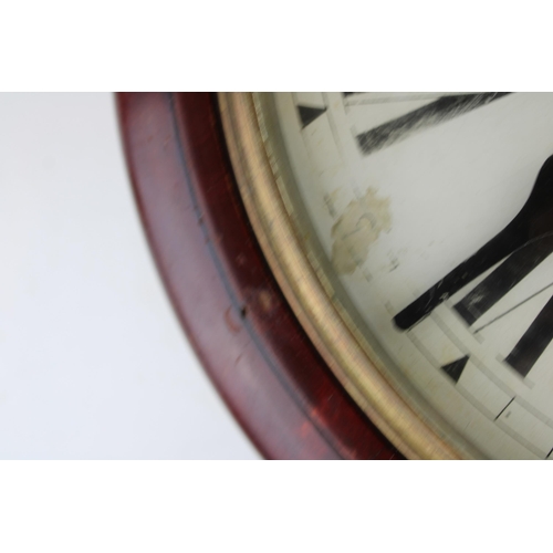 34 - A mahogany cased wall clock / school clock. Brass bezel with white dial and Roman numerals, glass wi... 