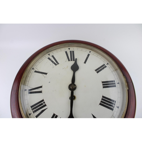 34 - A mahogany cased wall clock / school clock. Brass bezel with white dial and Roman numerals, glass wi... 