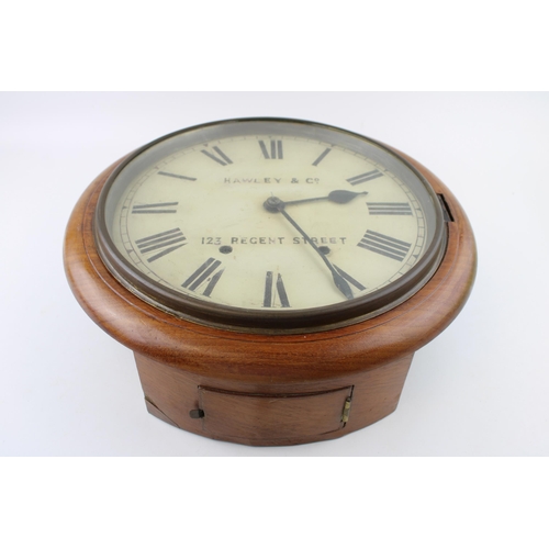 35 - An oak cased wall clock / school clock. Brass bezel with white dial and Roman numerals, HAWLEY & Co.... 