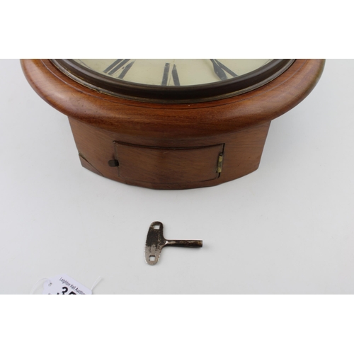 35 - An oak cased wall clock / school clock. Brass bezel with white dial and Roman numerals, HAWLEY & Co.... 