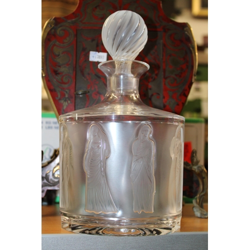 37 - A 20th Century Lalique glass decanter and stopper decorated in the 'Femmes' pattern, the design on f... 