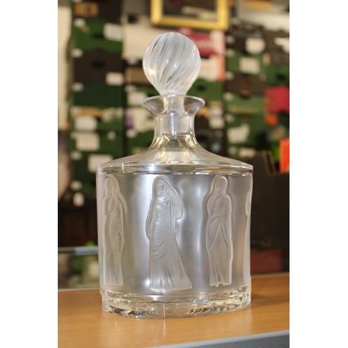 37 - A 20th Century Lalique glass decanter and stopper decorated in the 'Femmes' pattern, the design on f... 