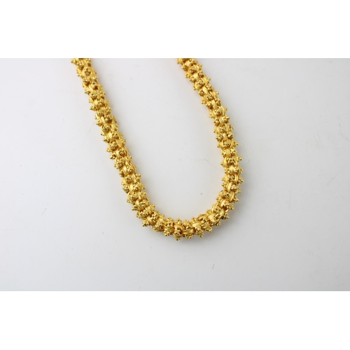 401 - A high carat gold necklace of large textured box link and bead form, originally purchased from Sifan... 