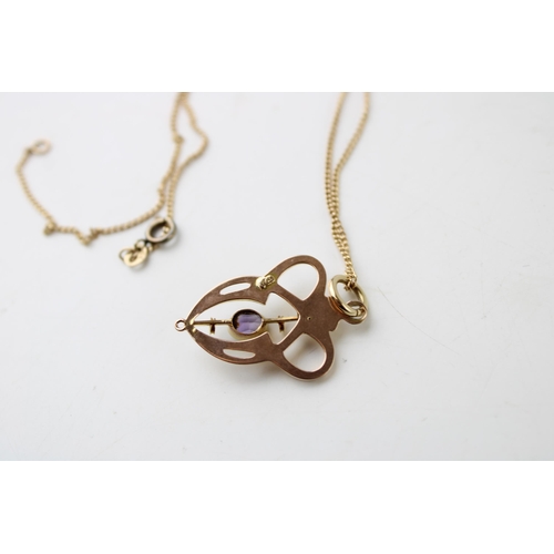 425 - An Art Nouveau 9ct gold and amethyst pendant, of swirling heart shaped form, with later jump ring an... 