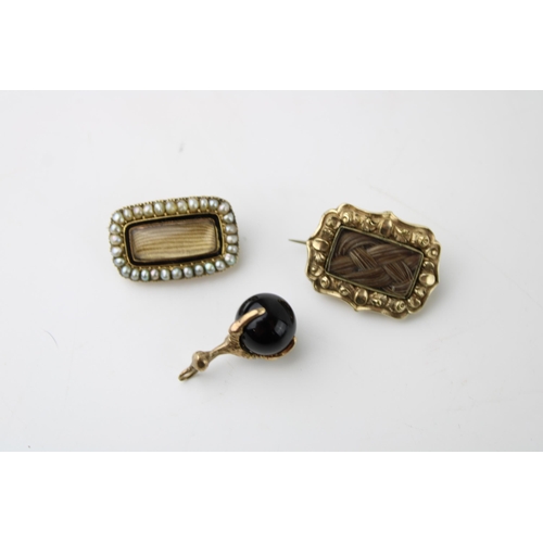 433 - A 19th century mourning brooch, set with seed pearls with black enamel border, another similar with ... 