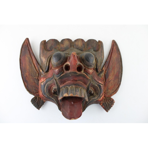 46 - An early 20th century Balinese hand carved Barong Mask. Height 21cm.