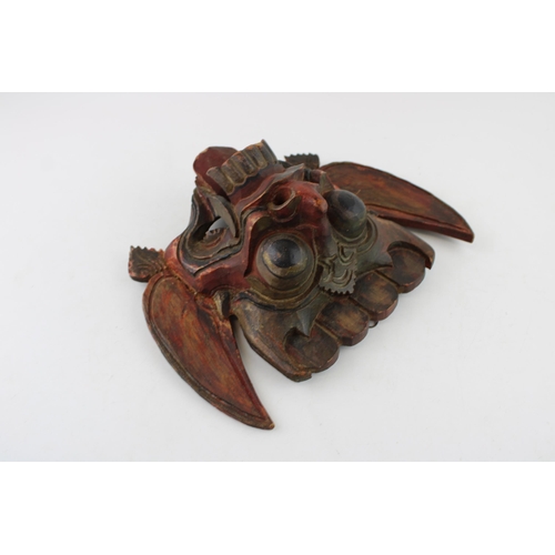 46 - An early 20th century Balinese hand carved Barong Mask. Height 21cm.