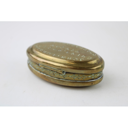 61 - An early c20th brass snuff box or tobacco twist tin inscribed 'John Powell, China Street, Fenton, St... 