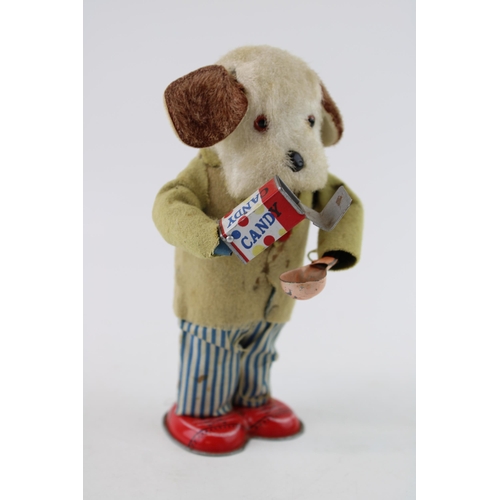 66 - Alps 'Greedy Pup' Japan clockwork tin toy, circa 1950's wearing a felt jacket with blue and white st... 