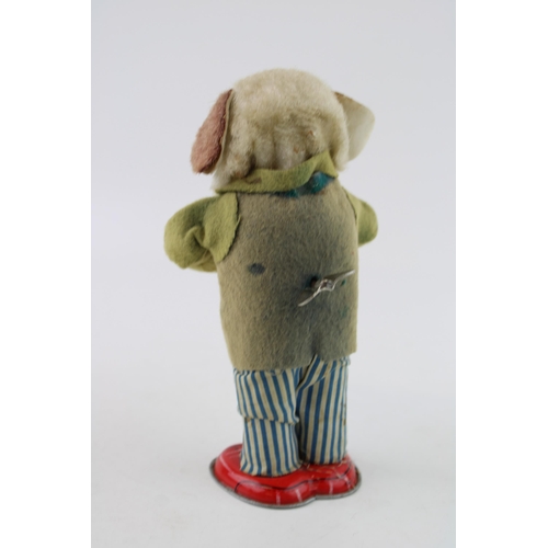 66 - Alps 'Greedy Pup' Japan clockwork tin toy, circa 1950's wearing a felt jacket with blue and white st... 