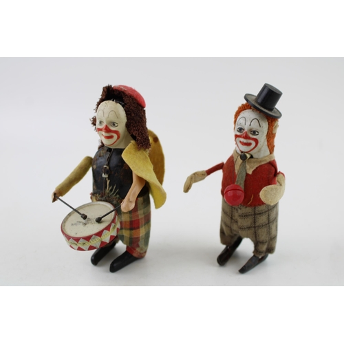 67 - Schuco No.965 Clown Juggler, red jacket and checked trousers, orange hair, black top hat, together w... 