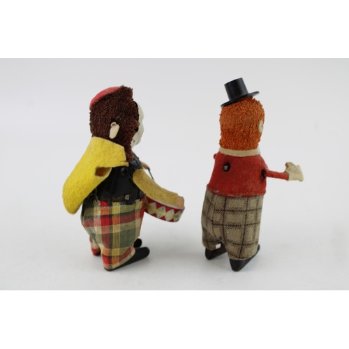 67 - Schuco No.965 Clown Juggler, red jacket and checked trousers, orange hair, black top hat, together w... 