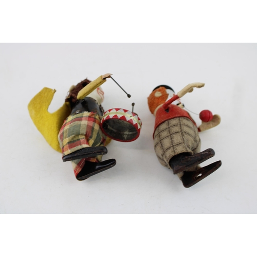 67 - Schuco No.965 Clown Juggler, red jacket and checked trousers, orange hair, black top hat, together w... 