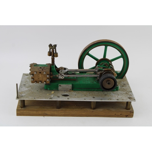 71 - A  model of an stationary horizontal engine mounted on an aluminium base and wooden board. Height 17... 