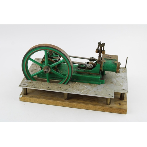 71 - A  model of an stationary horizontal engine mounted on an aluminium base and wooden board. Height 17... 