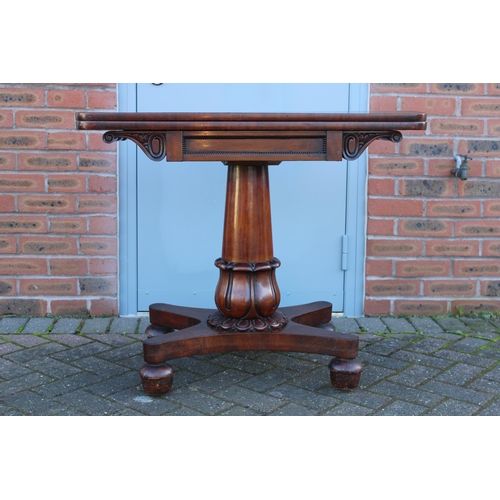 33A - William IV / early Victorian mahogany games table, carved tapered column, raised on four acorn feet,... 