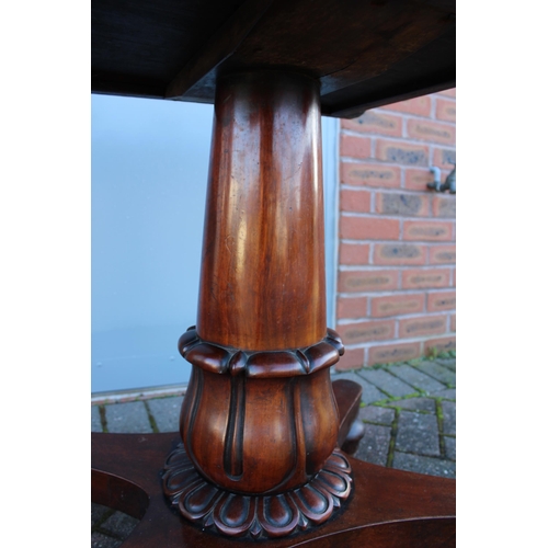 33A - William IV / early Victorian mahogany games table, carved tapered column, raised on four acorn feet,... 