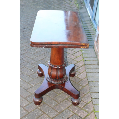 33A - William IV / early Victorian mahogany games table, carved tapered column, raised on four acorn feet,... 