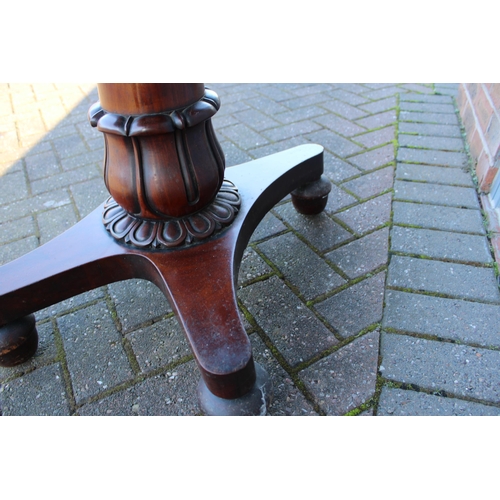 33A - William IV / early Victorian mahogany games table, carved tapered column, raised on four acorn feet,... 