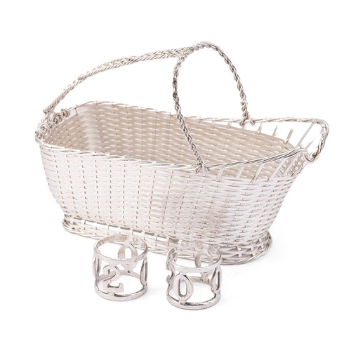 35 - A Christophle silver plated wine bottle basket complete with original box,  and a pair of millenium ... 