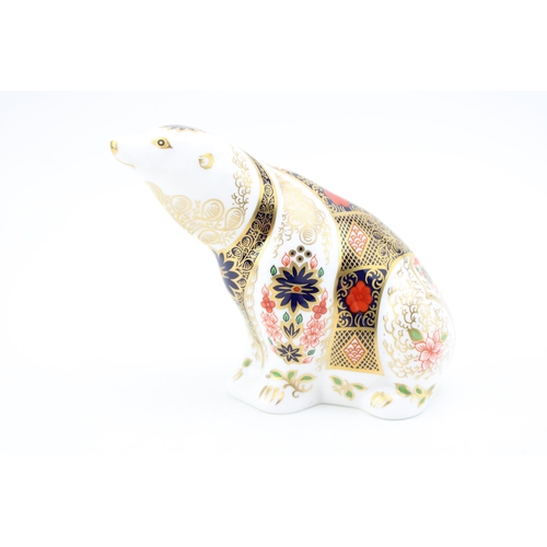 103 - A Royal Crown Derby paperweight, Old Imari Polar Bear, 11cm, hand signed in gold by Louise Adams and... 