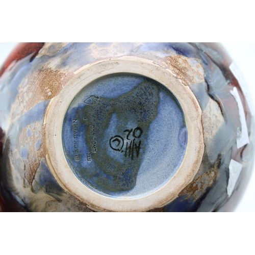 123 - A pair of Black Ryden squashed bulbous vases, signed by Anita Harris, dated 2002, 15cm diameter (2).