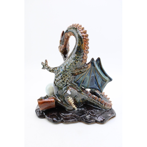 144 - Anita Harris unique model of a dragon, signed to base by Peter Harris, with orb, stoneware effect, 2... 