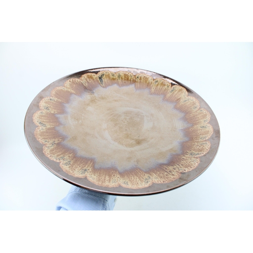 158 - Large Poole Pottery charger in copper lustre colourway, 41cm diameter.