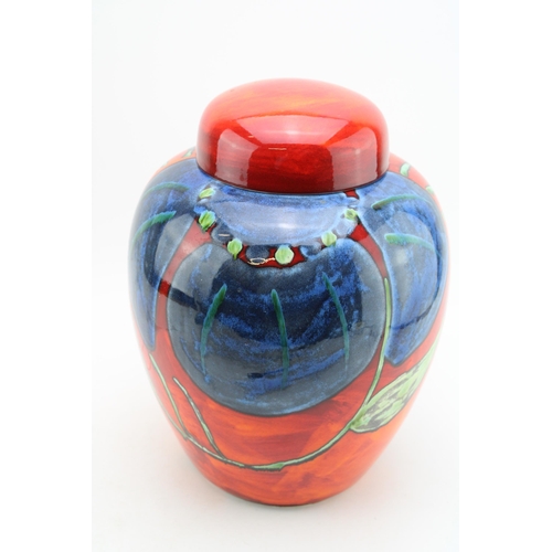 165 - A large Poole Pottery lidded ginger jar in the 'Himalayan Poppy' pattern, signed Jackie Moulton. Hei... 