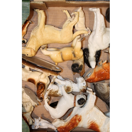 169 - A collection of ceramic dogs by Cooper Craft and other similar manufacturers. (Qty)