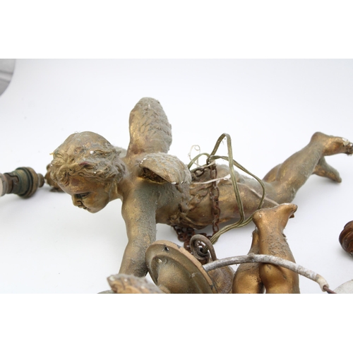 173 - Three vintage ceramic light fittings in the form of cherubs. Gilt finish with attachments for cellin... 