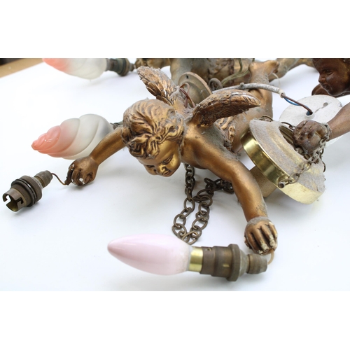 173 - Three vintage ceramic light fittings in the form of cherubs. Gilt finish with attachments for cellin... 