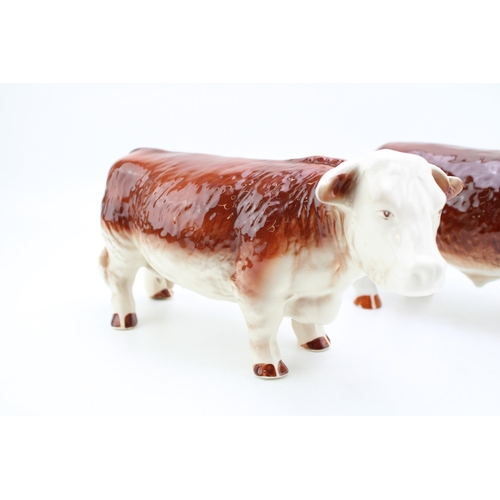 186 - Butchers shop Hereford Staffordshire pottery figures to include a Hereford Cow and a Hereford Bull (... 