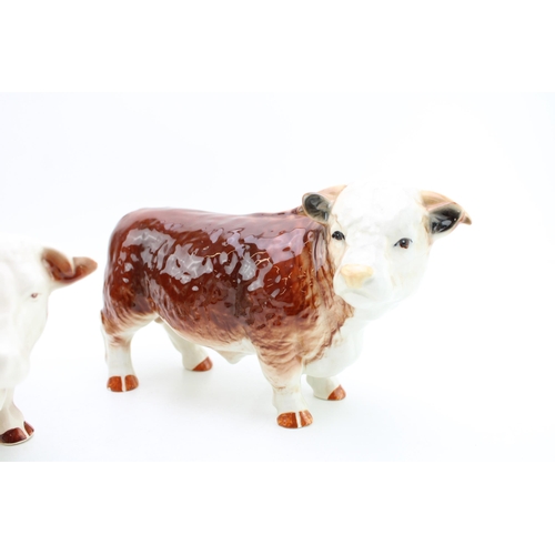 186 - Butchers shop Hereford Staffordshire pottery figures to include a Hereford Cow and a Hereford Bull (... 