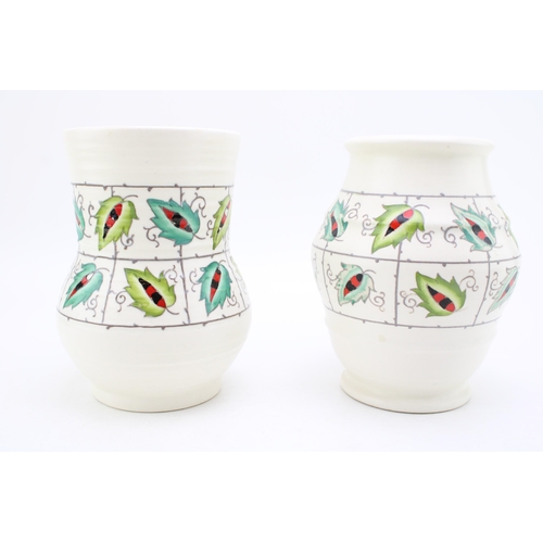 200 - Two Charlotte Rhead for Crown Ducal vases, both ribbed forms, largest 18cm tall (2).