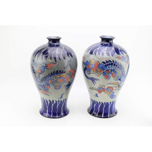 202 - A near pair of large Royal Cauldon baluster vases, with dragon design, grey backgroud, probably Fred... 