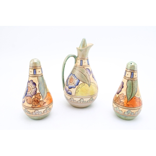 203 - A tubelined cruet set, assumed Charlotte Rhead for Crown Ducal or Bursley Ware, to include vinegar w... 