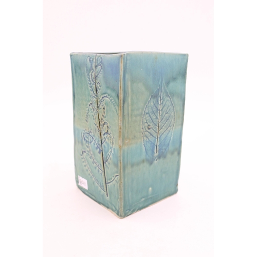 212 - A studio pottery 'Old Fern' type vase in blue / green glaze. Sticker to base, F / P. Height 16.5cm.