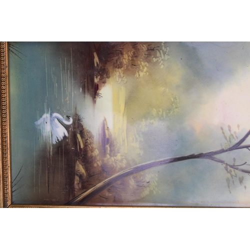 218 - A framed late 19th century painted porcelain tile, depicting a swan gliding across a woodland lake, ... 