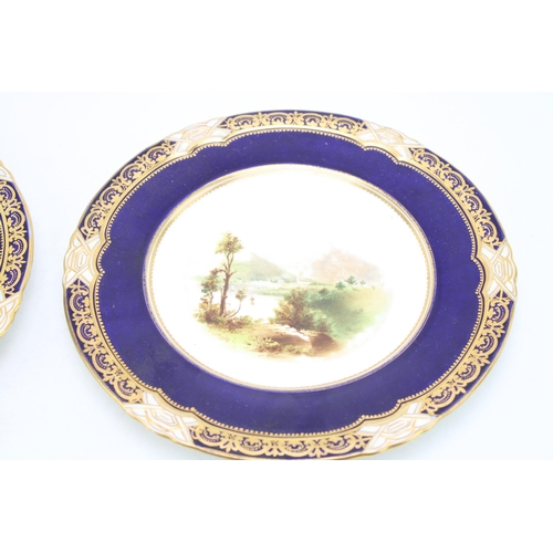 222 - A trio of cabinet plates, each with cobalt blue border with gilt highlights, to include two Coalport... 