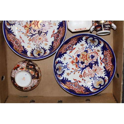 233 - A collection of Davenport pottery in the Imari pattern to include vases, cups and saucers, dishes et... 