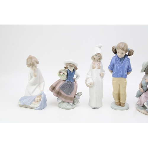 238 - A collection of Lladro to include an Angel with Bab 4635, a Girl with Flowers 5221, a lady with her ... 