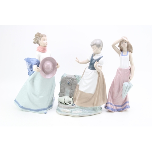 239 - Three large Nao figurines to include a girl with a broken vase, a girl holding her hat and a girl wi... 