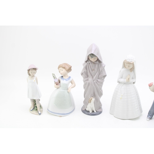 243 - Nao figures to include a bride, a boy in a long overcoat, a girl holding a flower and others (5), ta... 